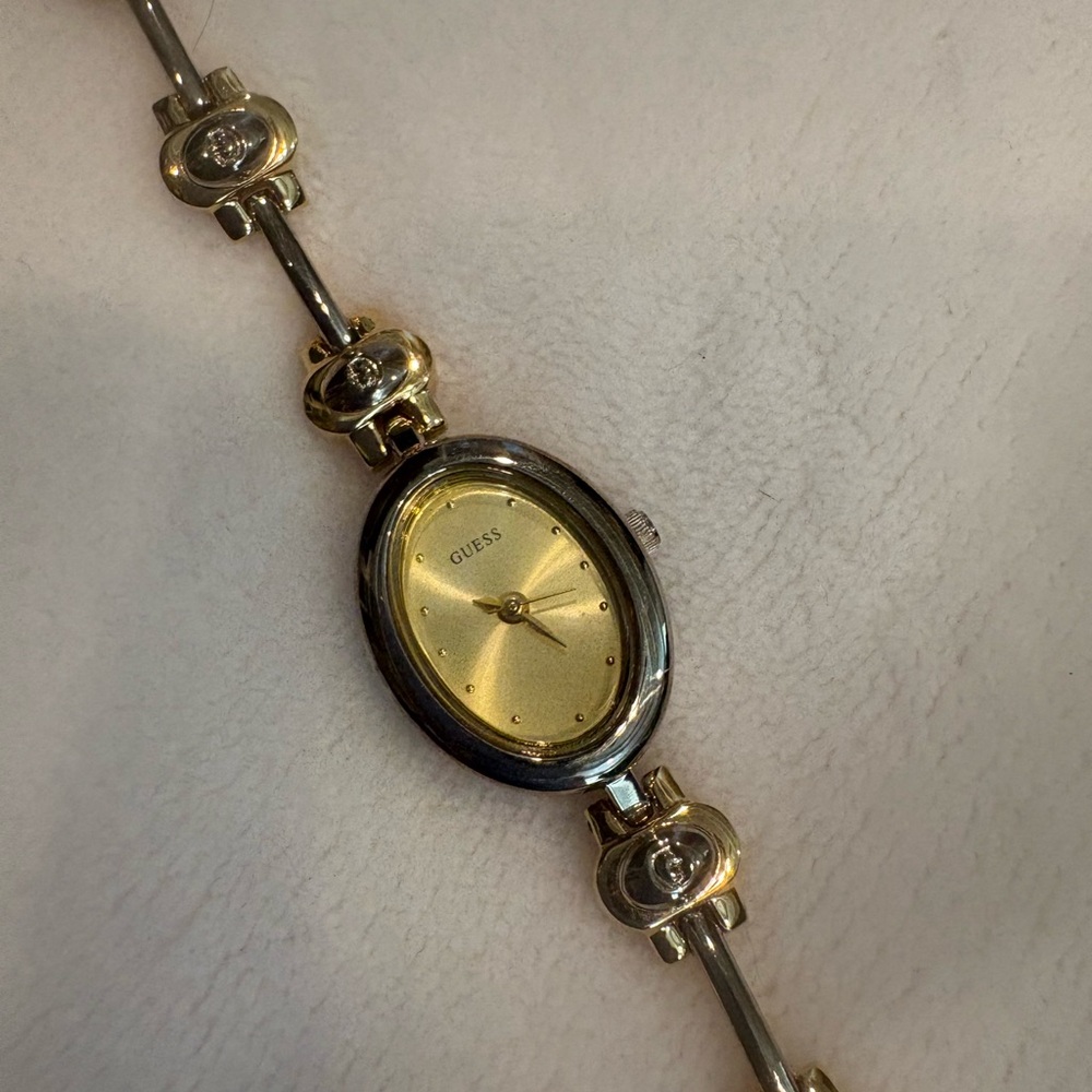Guess Women's Gold Dial and Silver Bracelet Watch